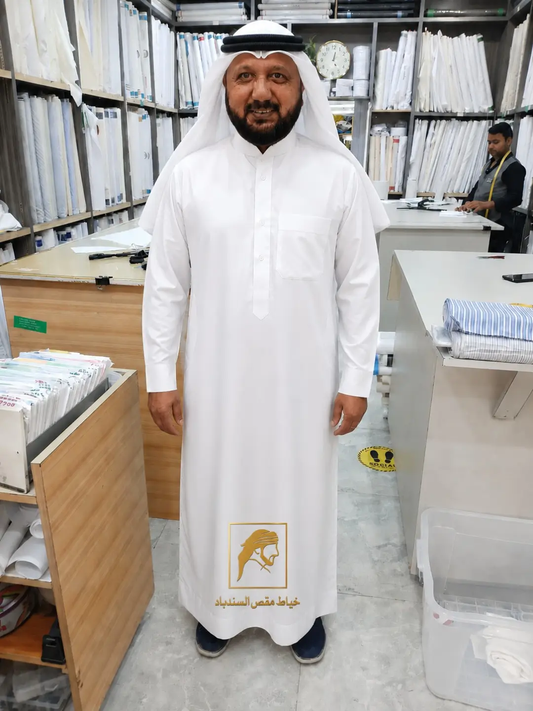 Customer wearing a premium white custom Dishdasha tailored by Maqs Al-Sindbad Tailors in Kuwait.